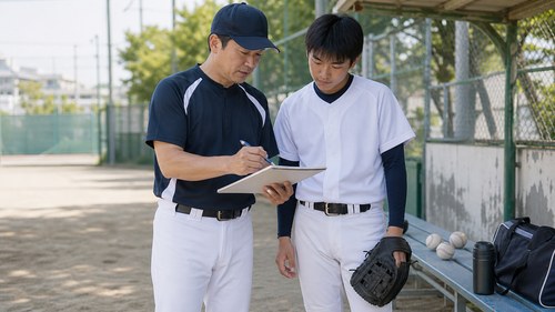 投球数と練習量を管理するコーチと選手